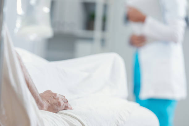 istock Senior man in hospital bed 694822424