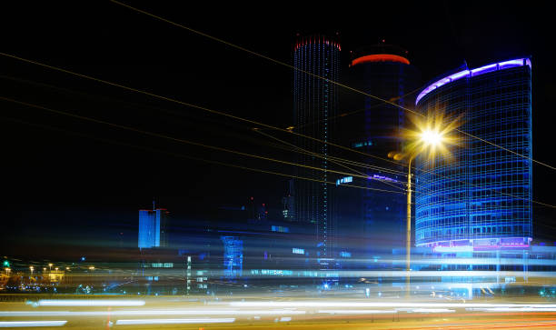 istock moving car with blur light through city at night 694825468