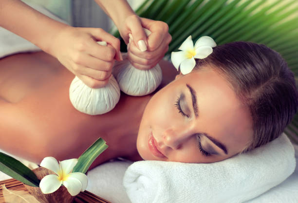 istock Woman is getting massage in the spa salon. 694828048