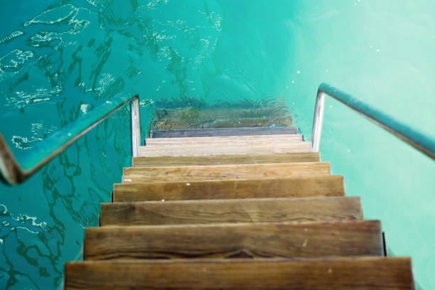 istock Ladder into mediterranean sea 694828206