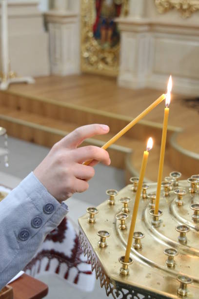 istock Burning candles in a church 694828316