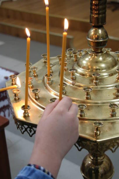 istock Burning candles in a church 694828338