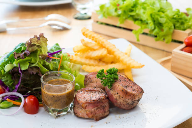 istock Grilled pork tenderloin Bacon rolls 694828696