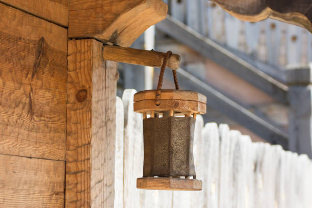 wooden lantern on ancient house made from tree board in ethnic style in the medieval settlement