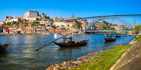 Panorama of Douro riverside Dom Luís I Bridge and Ribeira old town (Porto, Portugal).
