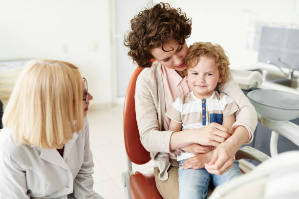 istock Calming son at dental checkup 694835236