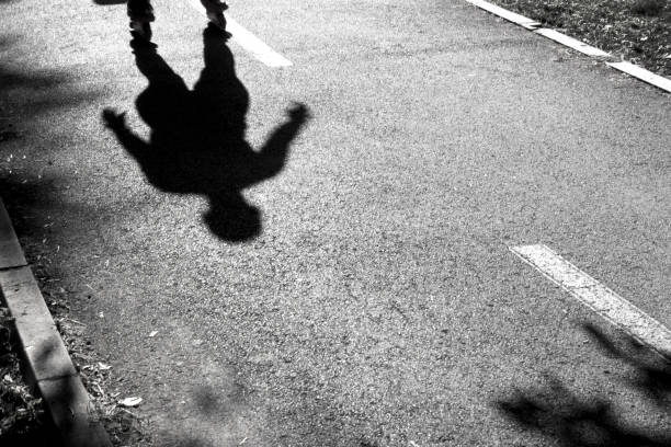 istock Blurry skater silhouette and shadow 694836516