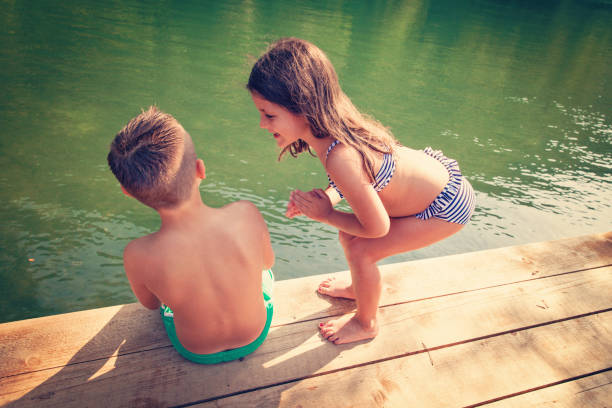 istock Summer Vacation - Children by the Lake 694848650