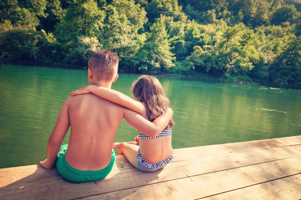 istock Summer Vacation - Children by the Lake 694848662
