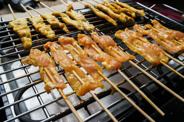 istock Pork sausages on grill. 694849320