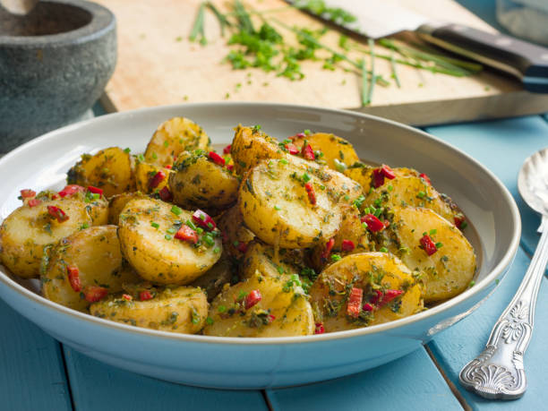 istock Spicy herbs potatoes salad 694852396