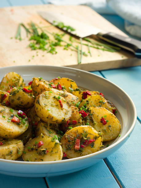 istock Spicy herbs potatoes salad 694852412
