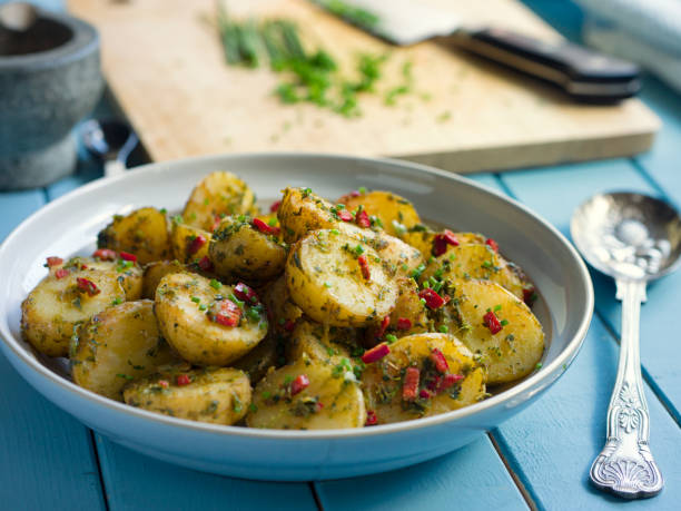 istock Spicy herbs potatoes salad 694852428
