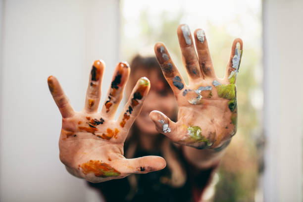 istock Artist showing her messy hands 694858262