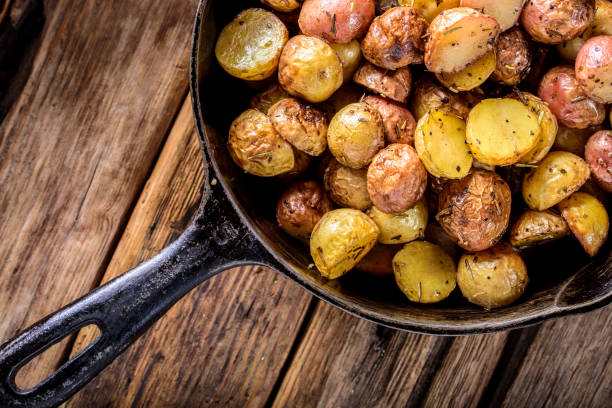 istock Pan Fried Yukon Gold Potatoes with Herb in Cast iron 694869900