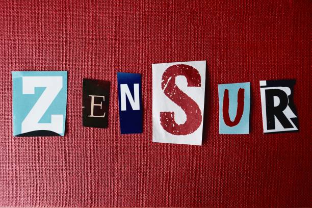 istock German word Zensur letters on dark red background 694880068