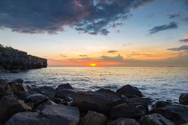 istock Sunset over rocky seacoast natural landscape skyline 694882064