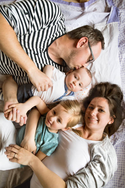istock Young family together at home. 694885212