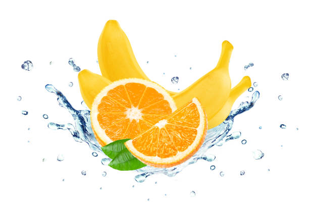 istock Banana and orange splash water 694886620