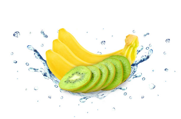 istock Banana and kiwi splash water 694893736