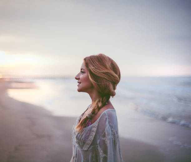 istock Dreamy girl  on beach 694894146