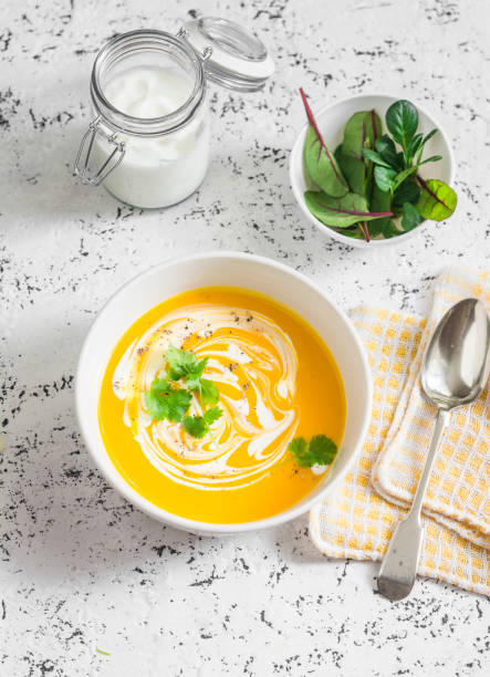 istock Caramelized golden beet and fall roots soup on a light background, top view. Vegetarian food concept 694894390