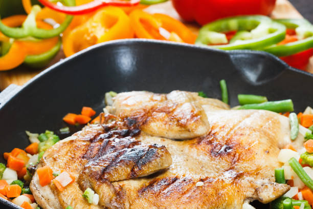 istock Whole grilled chicken on grill pan 694900392