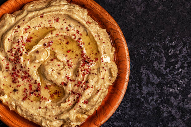 istock Classic hummus with parsley on the plate 694900616