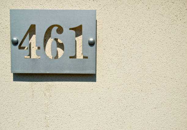 istock House numbers four hundreds and sixty one (461 four six one) on a gray background 694909822