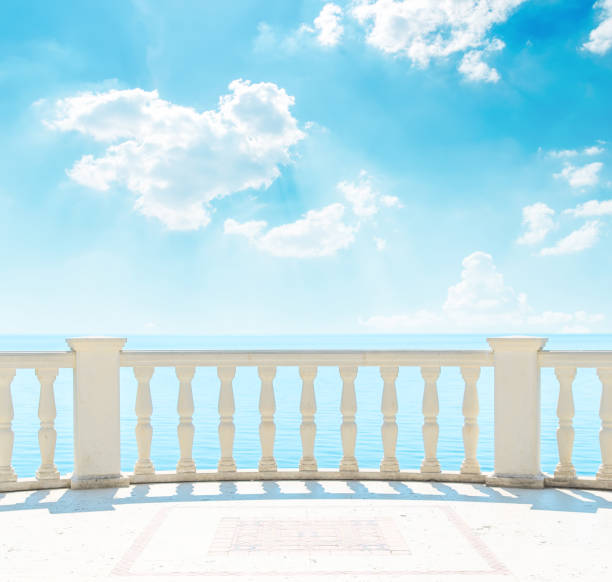 istock clouds in blue sky over sea and balcony 694919034