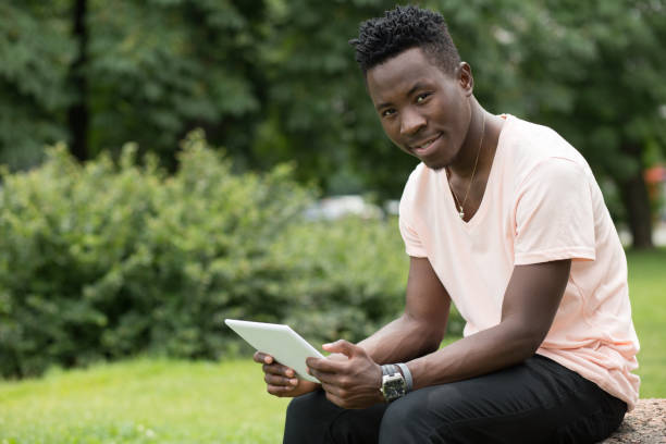 istock Man freelancer working with laptop in a nature 694924542
