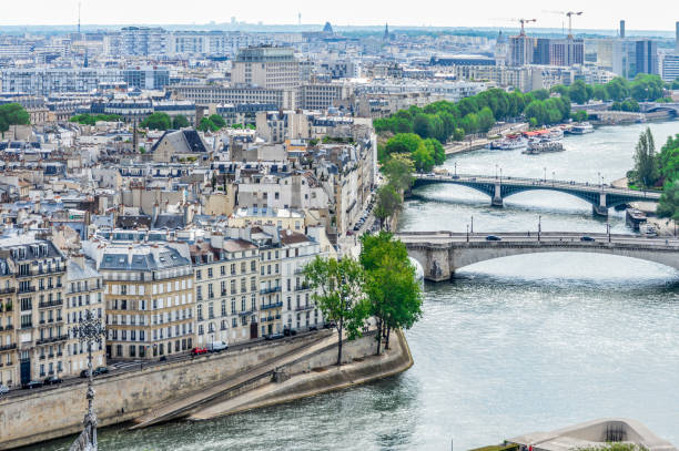 istock Paris street scene and architecture along the Seine River 694927420