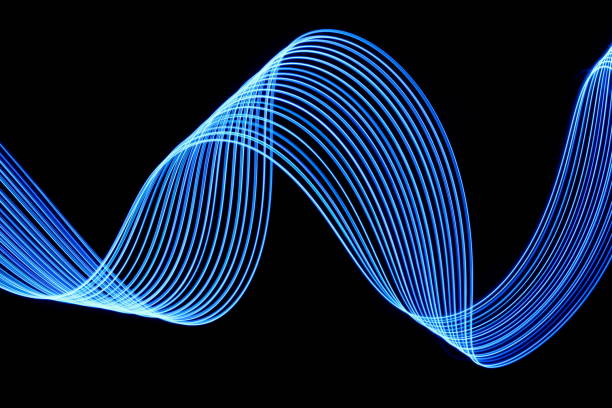 istock Blue Light Painting Photography, parallel lines pattern on a black background 694928528