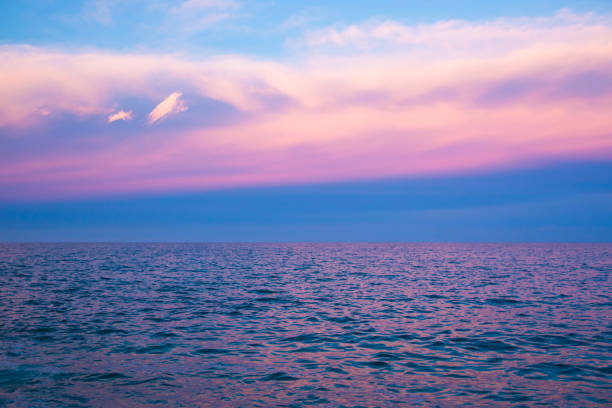 istock Sea and sky in pink color at sunset time 694928712