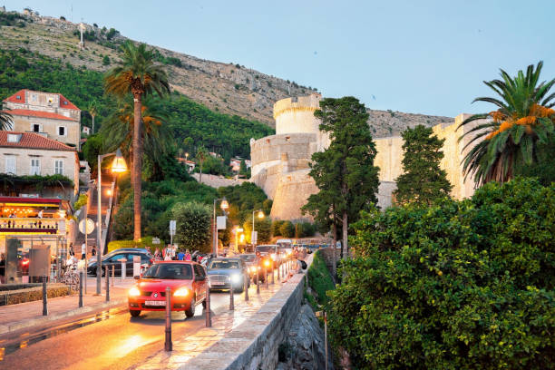 Old City Street and Fort Minceta in Dubrovnik in evening Dubrovnik, Croatia - August 18, 2016: Old City Street and Fort Minceta in Dubrovnik in evening, Croatia. People on the background fort minceta dubrovnik stock pictures, royalty-free photos & images