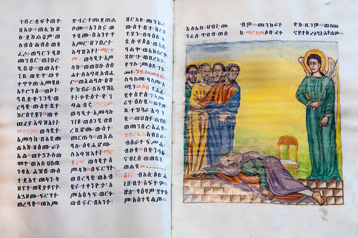 Jerusalem, Israel - December 8, 2013: A Bible written in ancient Geez language in the in Ethiopian Patriarchate in Jerusalem.