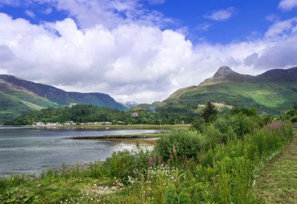 istock Beautiful Lake On Dramatic Sky In Scotland , UK 694959974