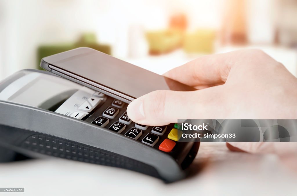 Mobile payment with smart phone Mobile payment with smart phone. payment nfc near field communication phone credit card concept Banking Stock Photo