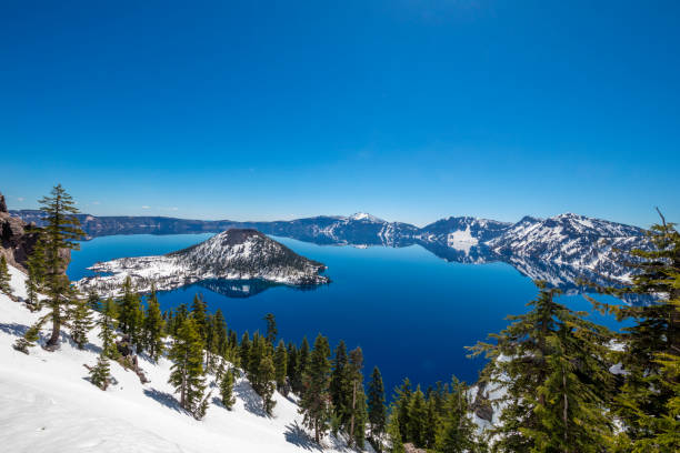 Crater Lake, Oregon Crater Lake, Oregon - US State, Lake, Memorial weekend, Caldera clear sky usa tree day stock pictures, royalty-free photos & images