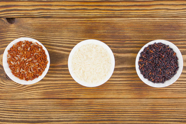 istock Raw blue rice in bowl on  wooden background 694965852