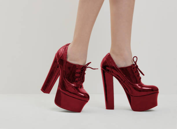 istock red high heels shoes on women's legs 694966096