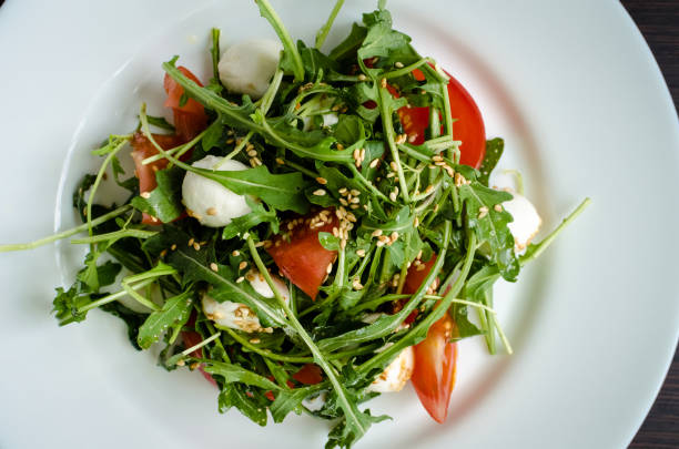 istock Fresh, summer salad with arugula leaves 694968816