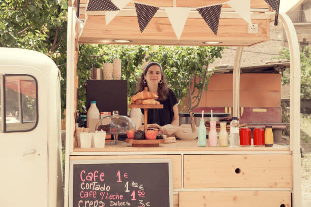 istock Scooter trycicle food truck and young woner 694969578