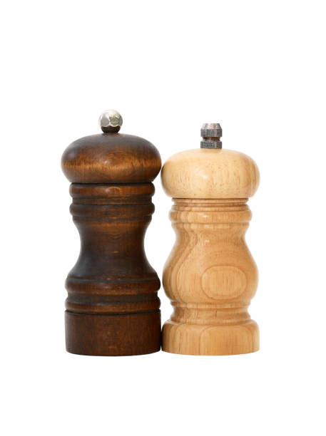 Pepper Mills On White stock photo