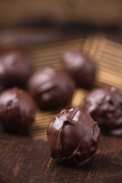istock Closeup truffles in chocolate 694977612
