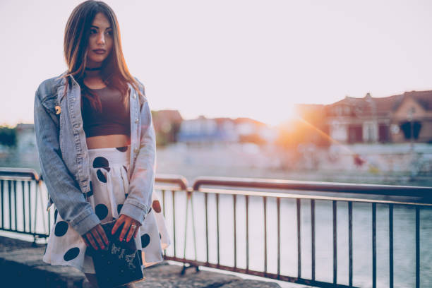 istock Young girl having a walk on the river hetty and holding diary 694980148