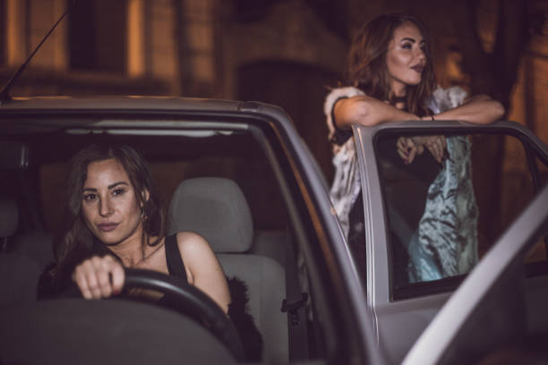istock Beat friends having night out and driving car 694980556