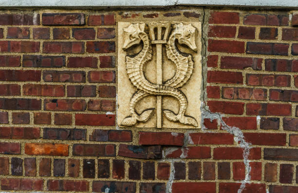 Bas-relief two seahorses on a old red brick wall, Brooklyn