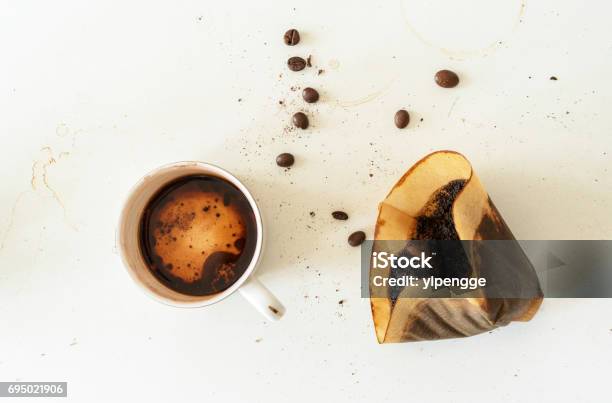 Coffee Beans Used Filter Paper And Residual In Coffee Cup Stock Photo - Download Image Now