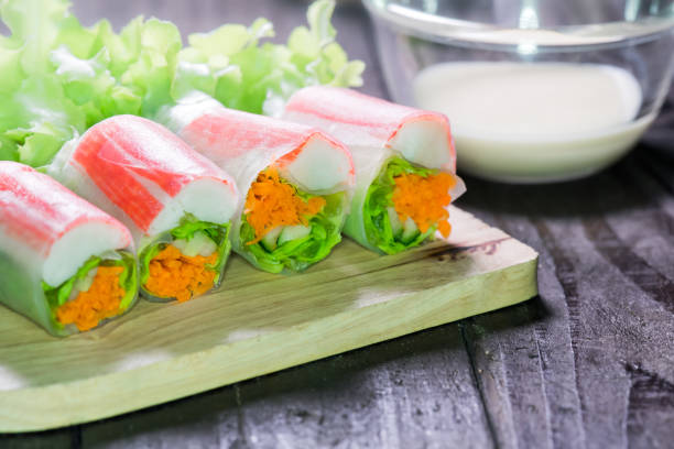 istock Salad roll with seafood, diet food 695031284